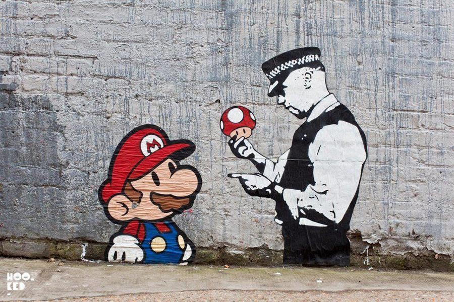 Street art of Super Mario having his mushroom inspected by a cop