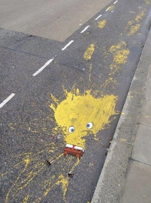 Yellow splatt of paint made to look like a run-over version of Sponge Bob Squarepants.