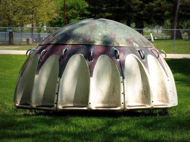 I think this was a version of the playground merry go round... .or perhaps some weird contraption for war protection?