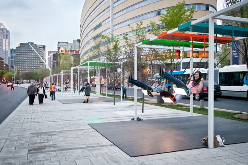 These swings installed on a street in Montreal that encourage activity and laughter are pretty cool