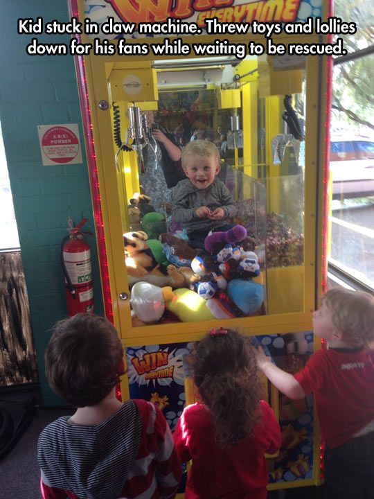 kid stuck in skill tester - Kid stuck in claw machine. Threw toys and lollies down for his fans while waiting to be rescued. We
