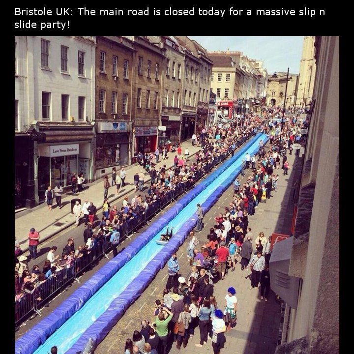 crowd - Bristole Uk The main road is closed today for a massive slip n slide party!