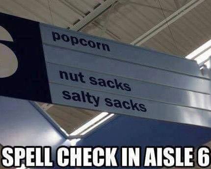 street sign - popcorn nut sacks salty sacks Spell Check In Aisle 6