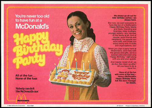 1980s mcdonalds birthday party ad with woman holding mcdonalds birthday cake - You're never too old to have fun at a McDonalds