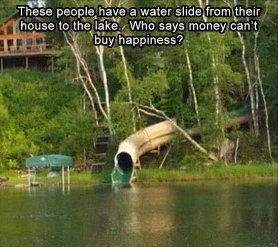 These people have a water slide from their house to the lake. Who says money can't buy happiness?