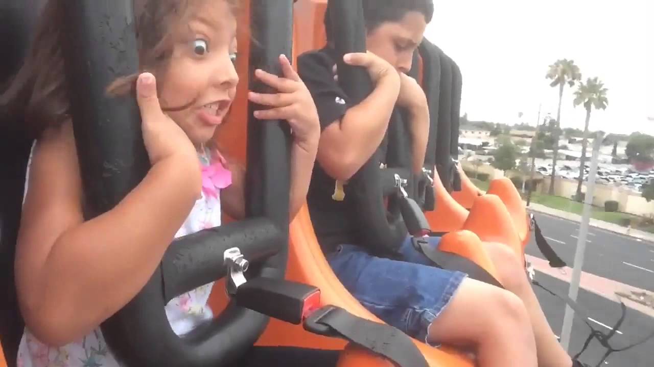 little girl on a roller coaster