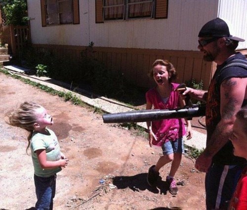 dad with leaf blower