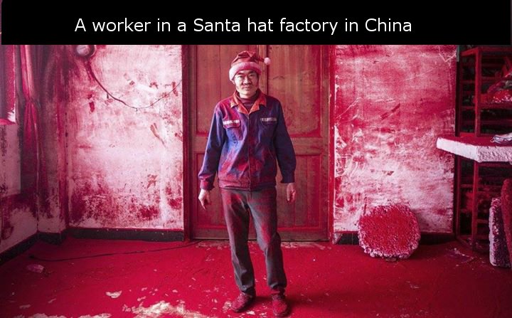 Christmas Day - A worker in a Santa hat factory in China