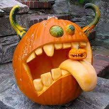 halloween pumpkin carving - big pumpkin vomiting tiny pumpkin