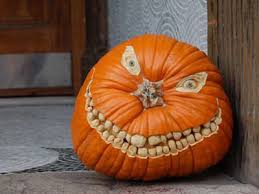 halloween pumpkin carving - creepy too many teeth realistic eyes