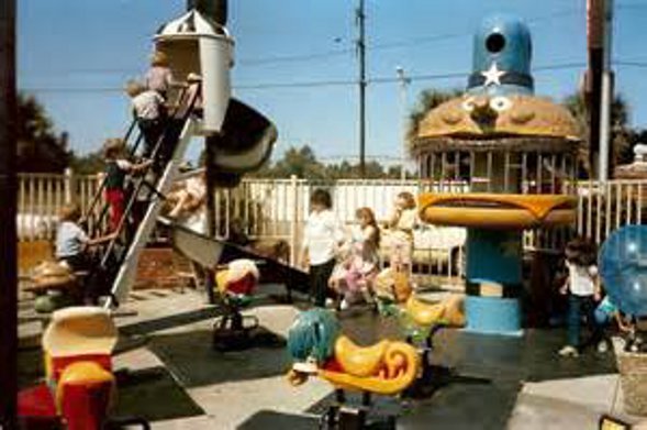 The playgrounds were so fun, some even had merry-go-rounds that you pressed a button to activiate