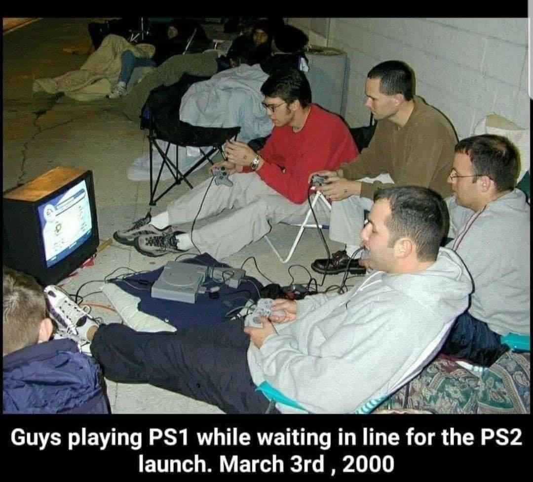 funny gaming memes - playing ps1 - Guys playing PS1 while waiting in line for the PS2 launch. March 3rd, 2000