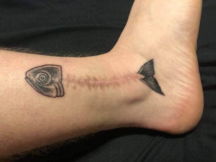 fish scar tattoo