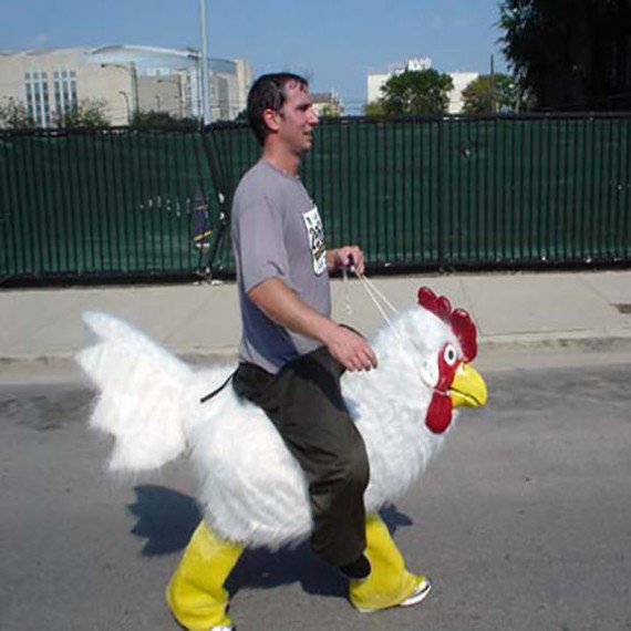 person running with chicken