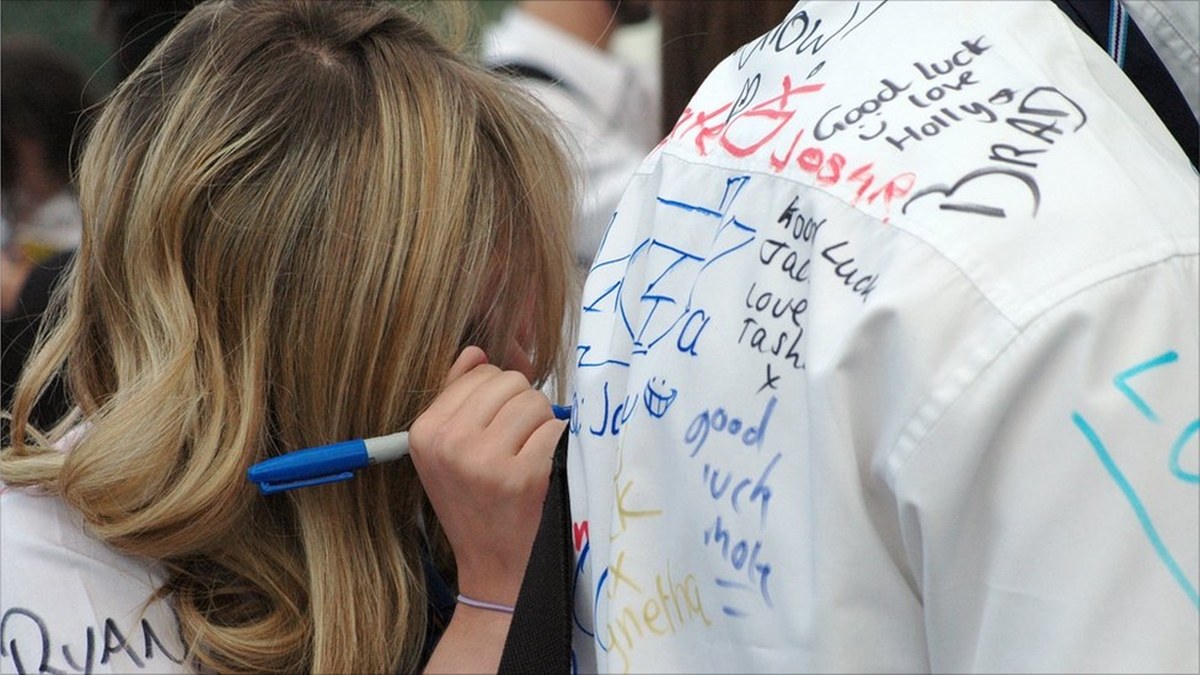 Writing long messages on each others' PE shirts