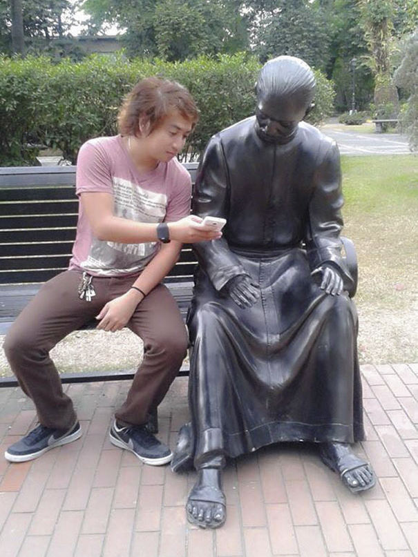 24 people taking statue posing to a new level