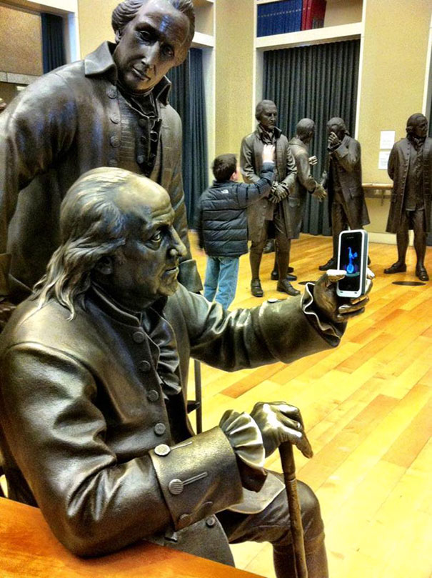 24 people taking statue posing to a new level