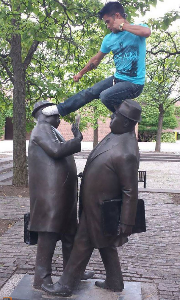 24 people taking statue posing to a new level