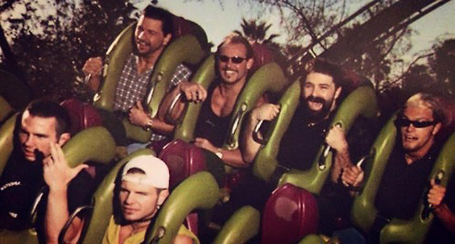 Matt and Jeff Hardy in the front, with Al Snow, Scotty 2 Hotty, Mick Foley and Edge in the back of a roller coaster.