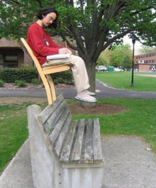 random weird pic guy balancing on chair