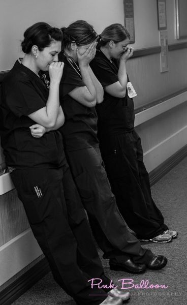 Nurses after a patient suffered a miscarriage