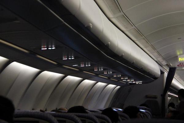 When taking off/landing at night, the lights are turned off in the cabin to adjust your eyes to darkness. In the event of an evacuation, you’ll be able to see better.