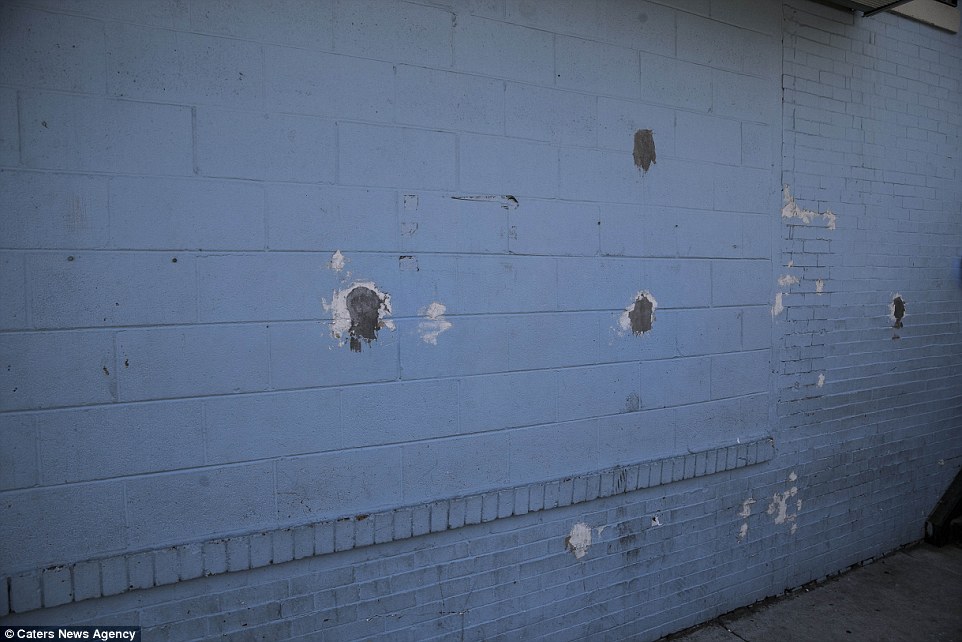 Bullet holes pictured here are evidence of the fact that there are nearly 2,000 violent crimes committed in this small city every year, and 57 of those are murders.