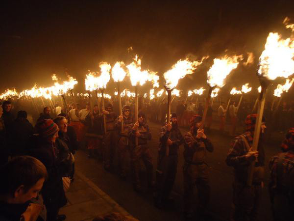 Up Helly Aa:
The name refers to any of a variety of fire festivals held in Shetland, Scotland during the winter. Locals generally form into squads who then march through the town or village in a variety of themed costumes.