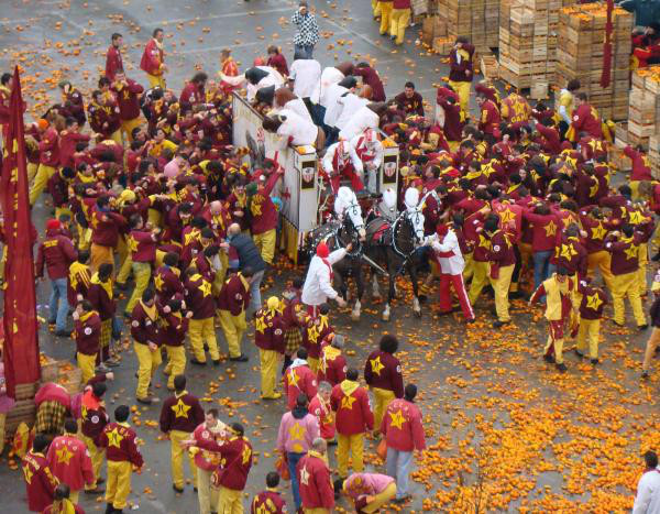 Battle of the Oranges:
The Battle of the Oranges is Italy’s largest food fight that takes place in Ivrea and consists of only oranges.