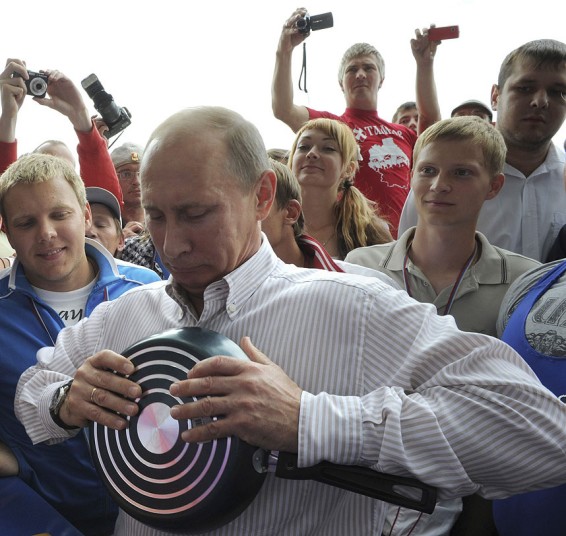 Putin bending a frying pan