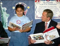 Reality: The original version of this photo was taken in the Summer of 2002 while Bush was visiting George Sanchez Charter School in Houston. It shows that Bush was holding the book rightside-up. An unknown hoaxer horizontally and vertically flipped the image on the back of the book to make it appear to be upside-down, for the purpose of political humor.