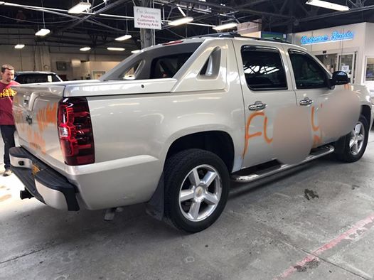 defaced pickup truck from back view