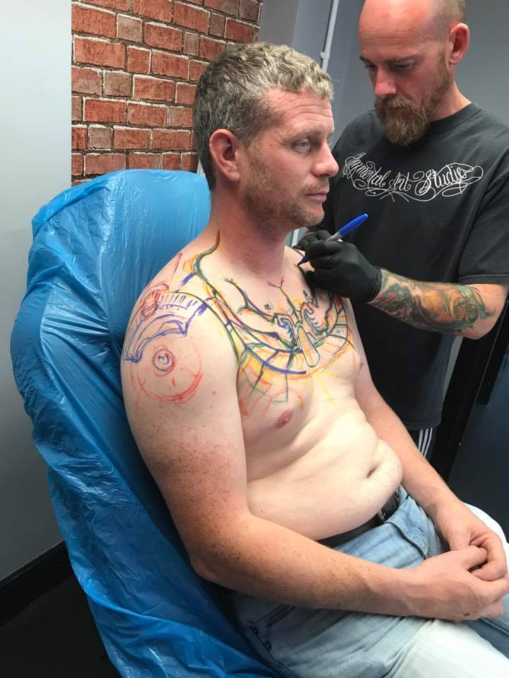 It looks like he has a few more sessions before it's complete and it looks like his shoulders will be the tires, but I just can't help but wonder if they tattoo is exhaust pipe too. Now that's not an image anyone would want to see anytime soon. 