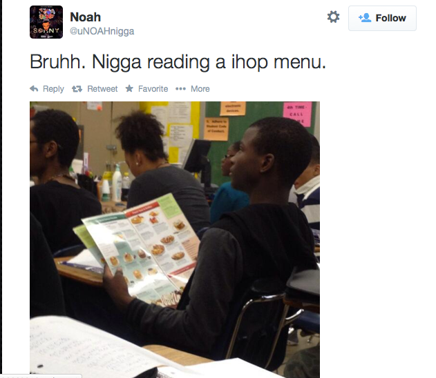 Funny meme from a black person of dude reading ihop menu in class.
