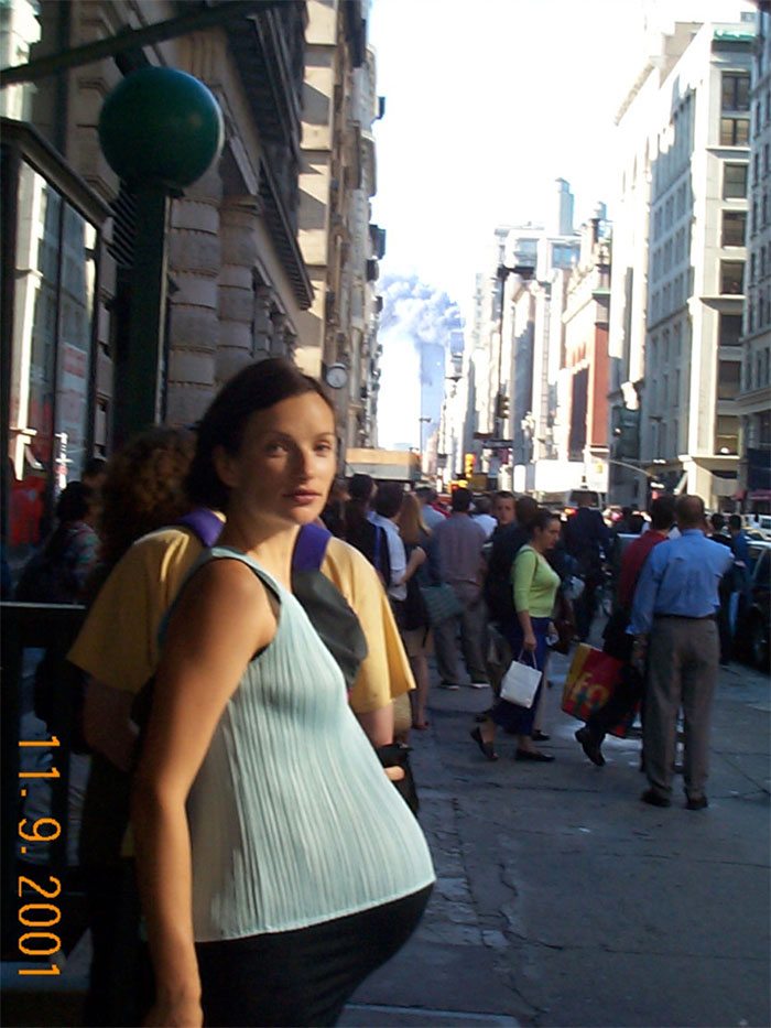 Pregnant woman in photo with WTC burning in the background
