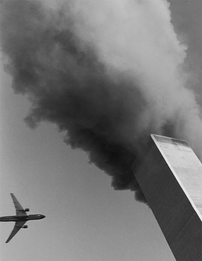 Black and white photo of airplane going into the tower on September 11th 2001