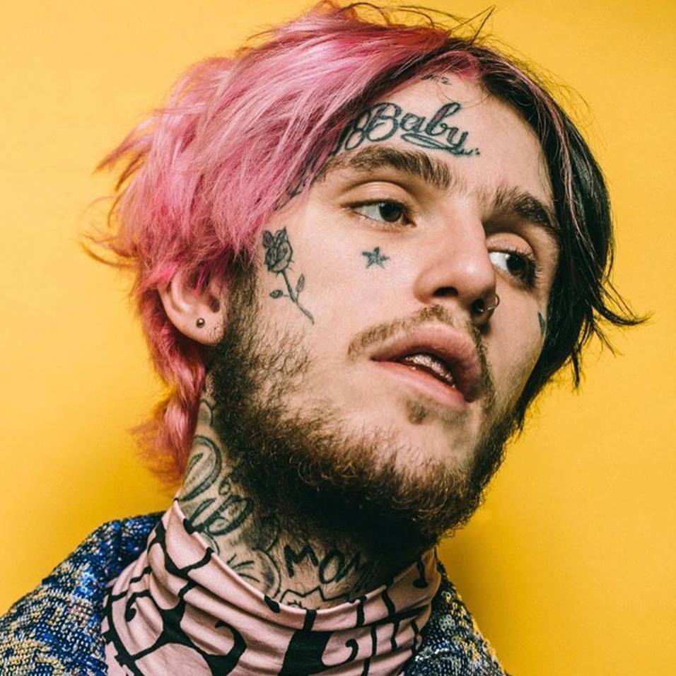 Lil Peep's look compared to the rest of the featured rapper is 'mild' to say the least. At least his forehead says baby instead of a gigantic 69 like our next entry. 