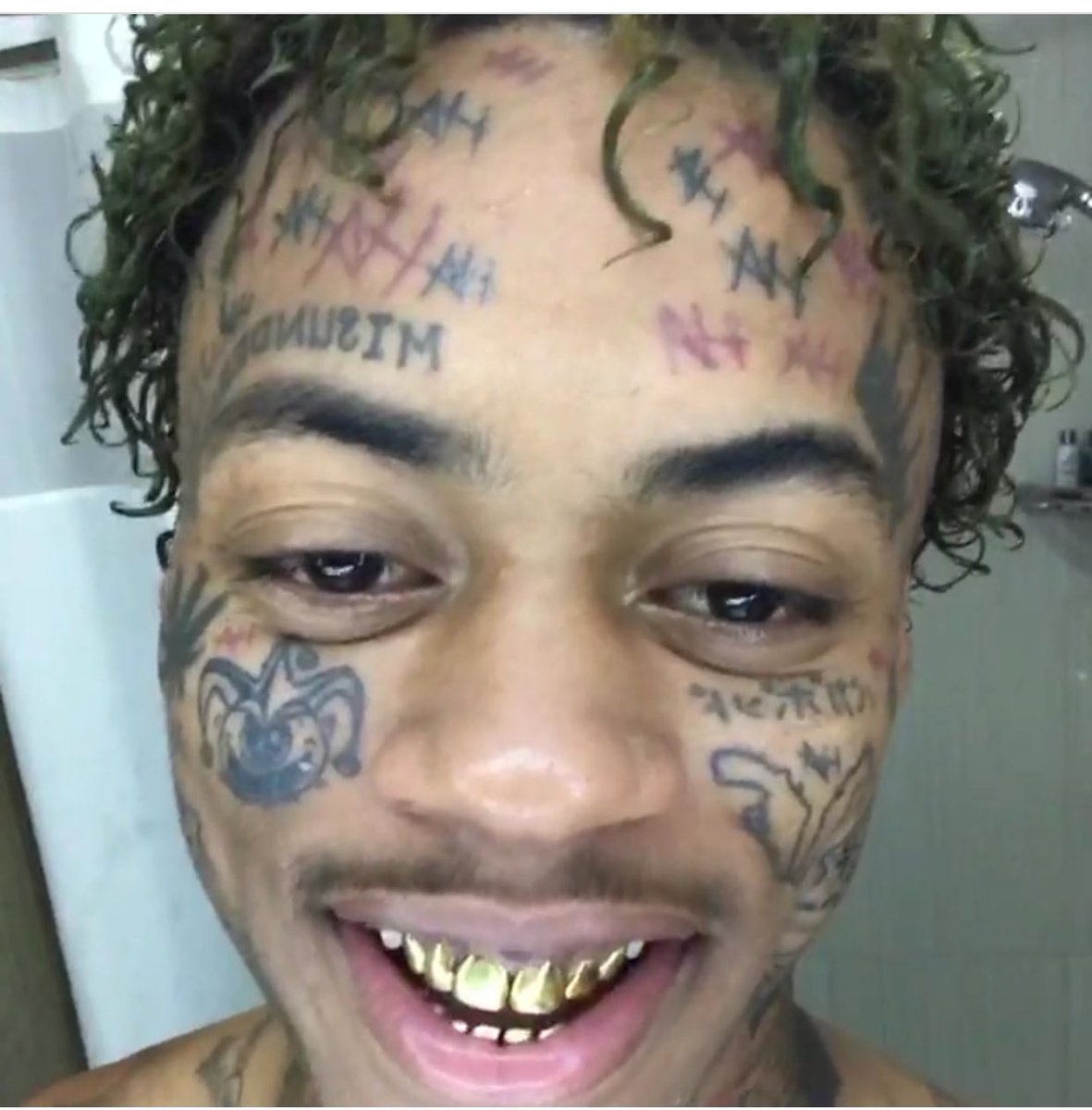 Boonk, what were you thinking man? Oh, that's right you weren't, because no one with any sense in their brain would get such shitty tattoos on their face. 