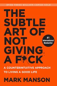 Mark Manson's <a href="https://amzn.to/2MiHzUd" target="_blank">The Subtle Art Of Not Giving A Fuck</a> a generation-defining self-help guide, a superstar blogger cuts through the crap to show us how to stop trying to be "positive" all the time so that we can truly become better, happier people.