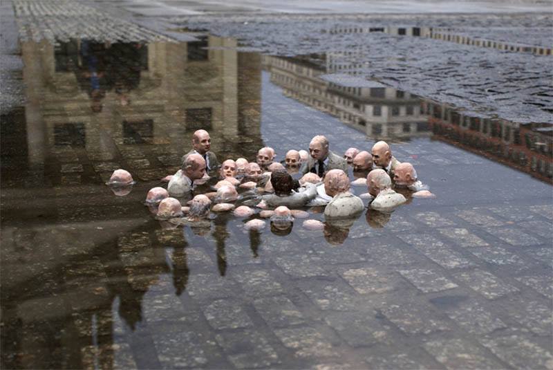 Sculpture by Issac Cordal in Berlin, called "Politicians Discussing Global Warming"
