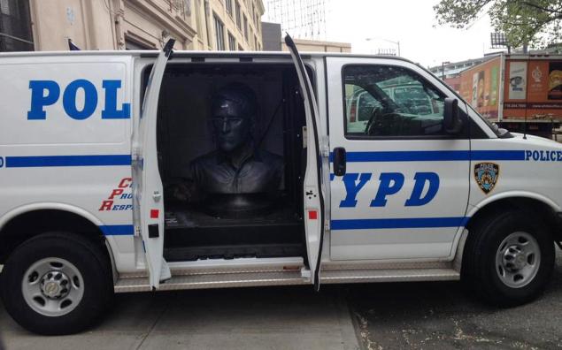 Large Bust of Edward Snowden Inside a Police Van