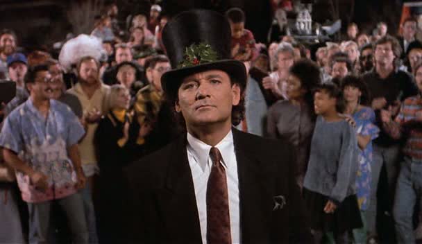 Scrooged (1988) - Bringing the old Dickens tale of A Christmas Carol to 1980s New York City, Frank Cross (Bill Murray) goes on a hilarious time traveling adventure to learn the true meaning of the holidays. The film was released four years after Ghostbuster with the tagline, "Bill Murray is back among the ghosts, only this time, it's three against one."