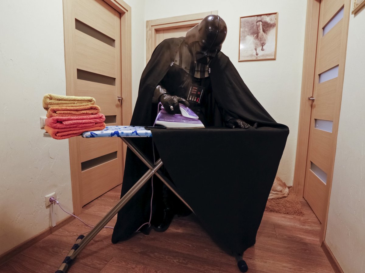 Lord Vader making sure his cloak is crisp and wrinkle free.