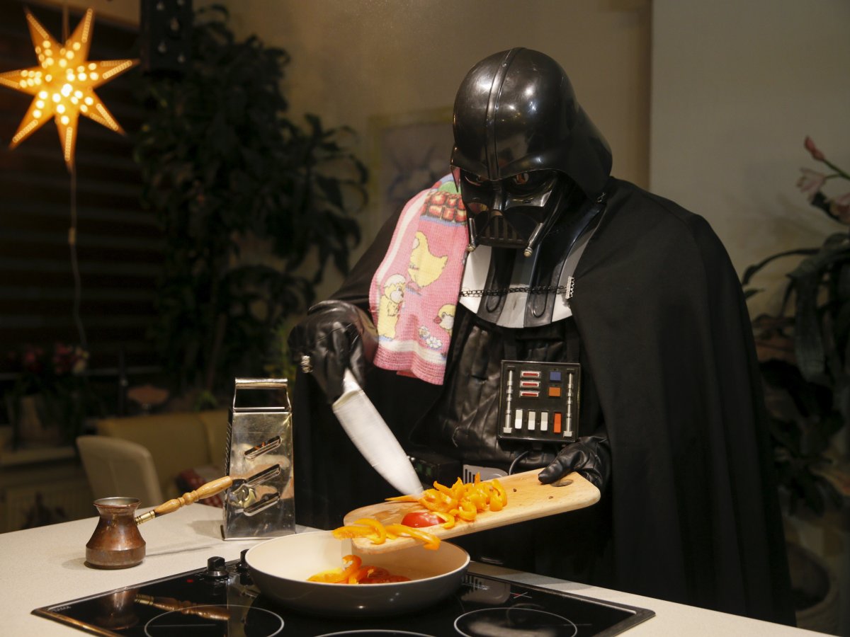 Vader using a more conventional cutting tool to chop up some veggies for a delicious meal.