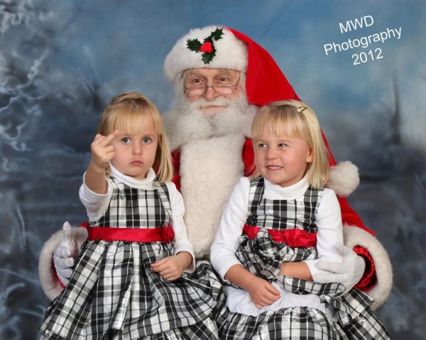 18 Of The Most WTF Christmas Photos Taken On Santa's Lap