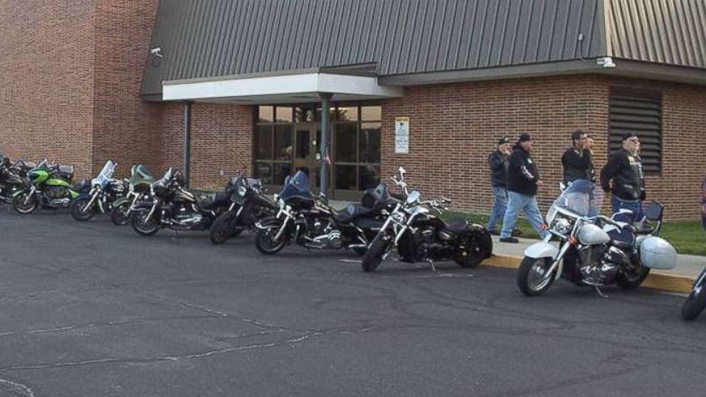 Bikers outside Phil's school, making sure no bully gets any ideas.