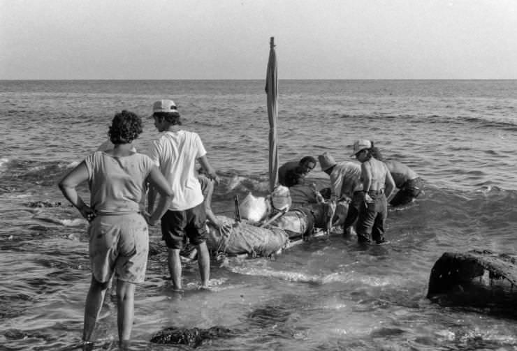 Some brave Cubans prepare to board a makeshift boat to sail to Florida in as part of the mass exodus of 1994. Many died, never making the 90 miles to the US.