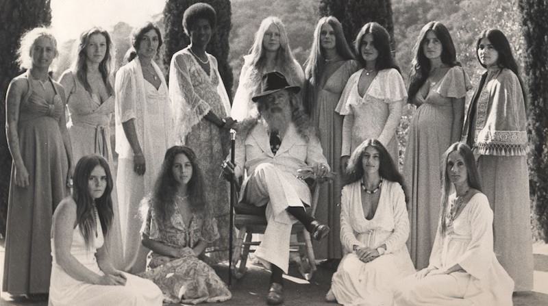 Father Yod of the Source Family with 13 of his 14 wives in 1973. Legally, he only had 1 wife, but he ran a spiritual cult which attracted 150 followers and even had a band called the Ya Ho Wha 13. The cults/communes ideals were clean, all natural living, basically everything that was at the very heart of the hippie movement of the 1970s.