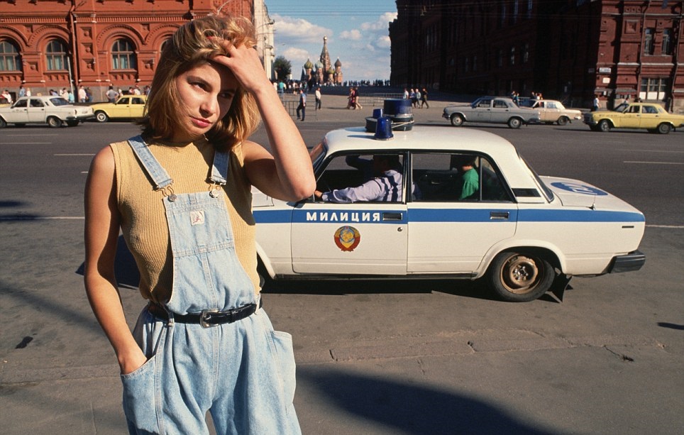 18 Year old prostitute Katya scours the street for work as a police car drives past her in Moscow in 1991. An interview at the time with Katya showed that unfortunately many young girls like her struggled mightily for work even as a prostitute as the collapse of the USSR created every issue imaginable as their entire world crashed around them.