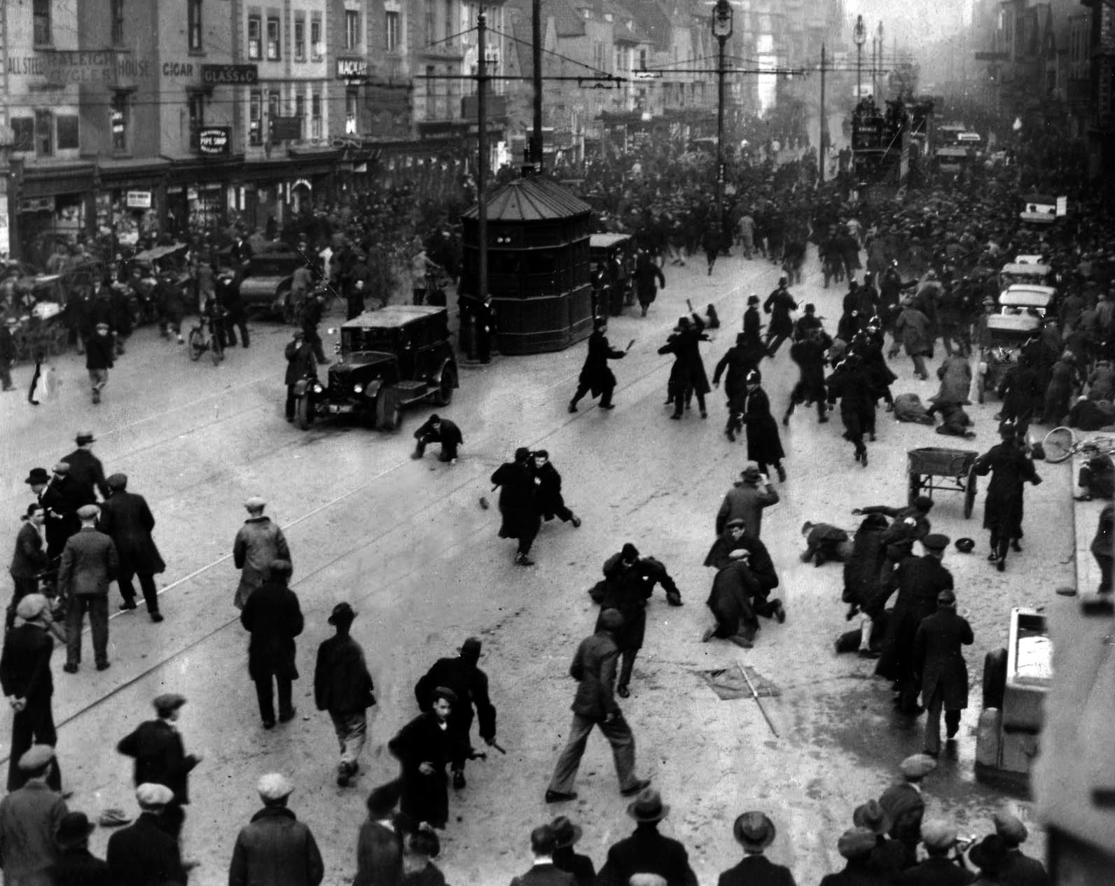 Police with batons charge around 3,000 unemployed workers who were marching down the city center of Bristol, UK, as part of The Old Market Riot in 1932. According to reports, the police decided to attack using force against a peaceful gathering to disperse the crowd.